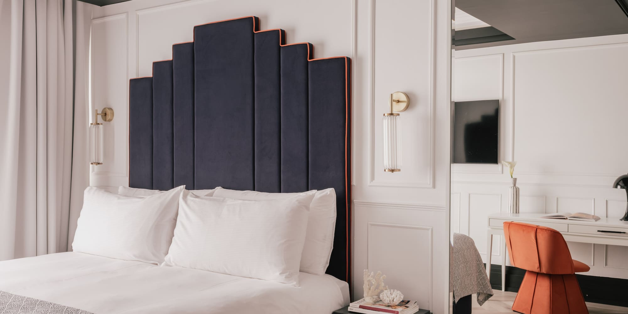 a room with a bed and a chair
