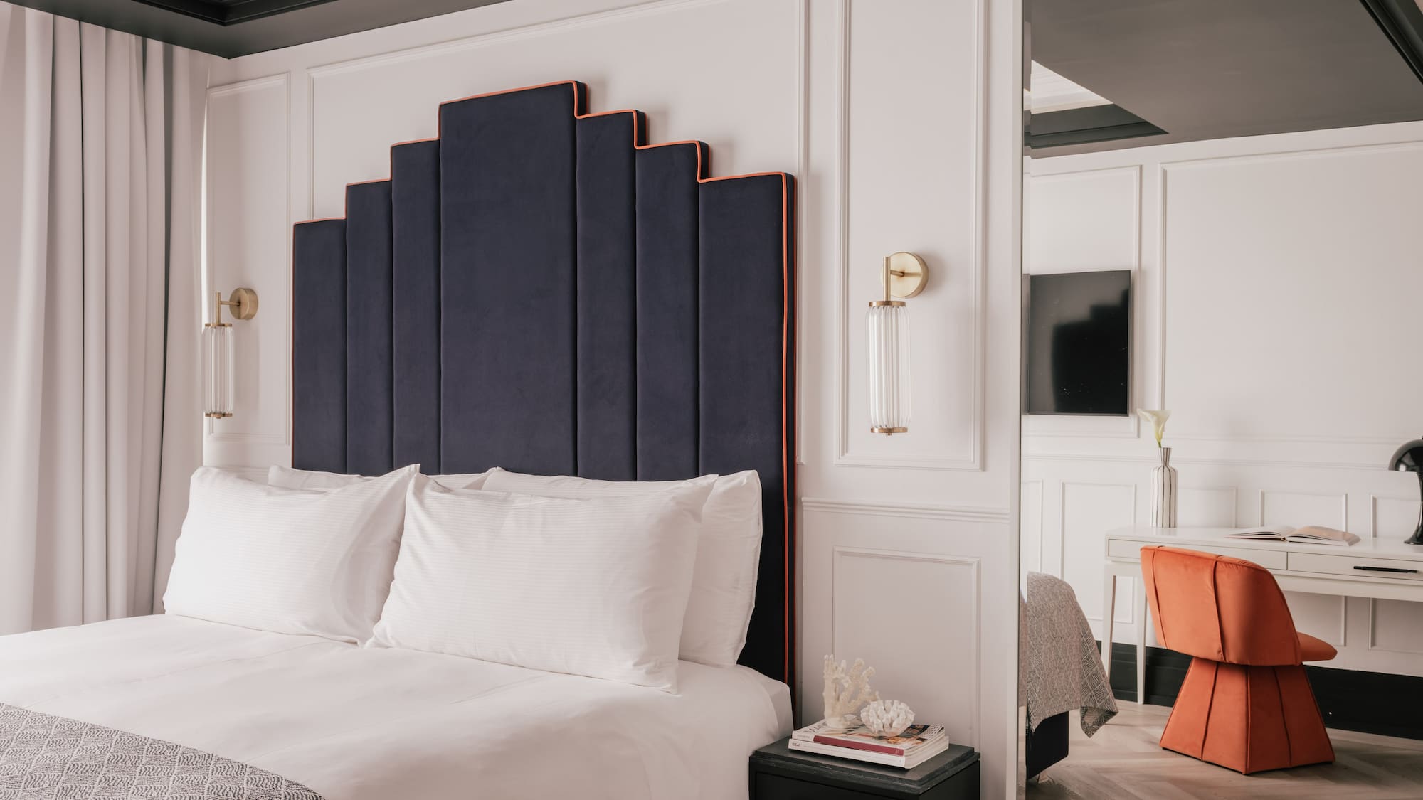a room with a bed and a chair