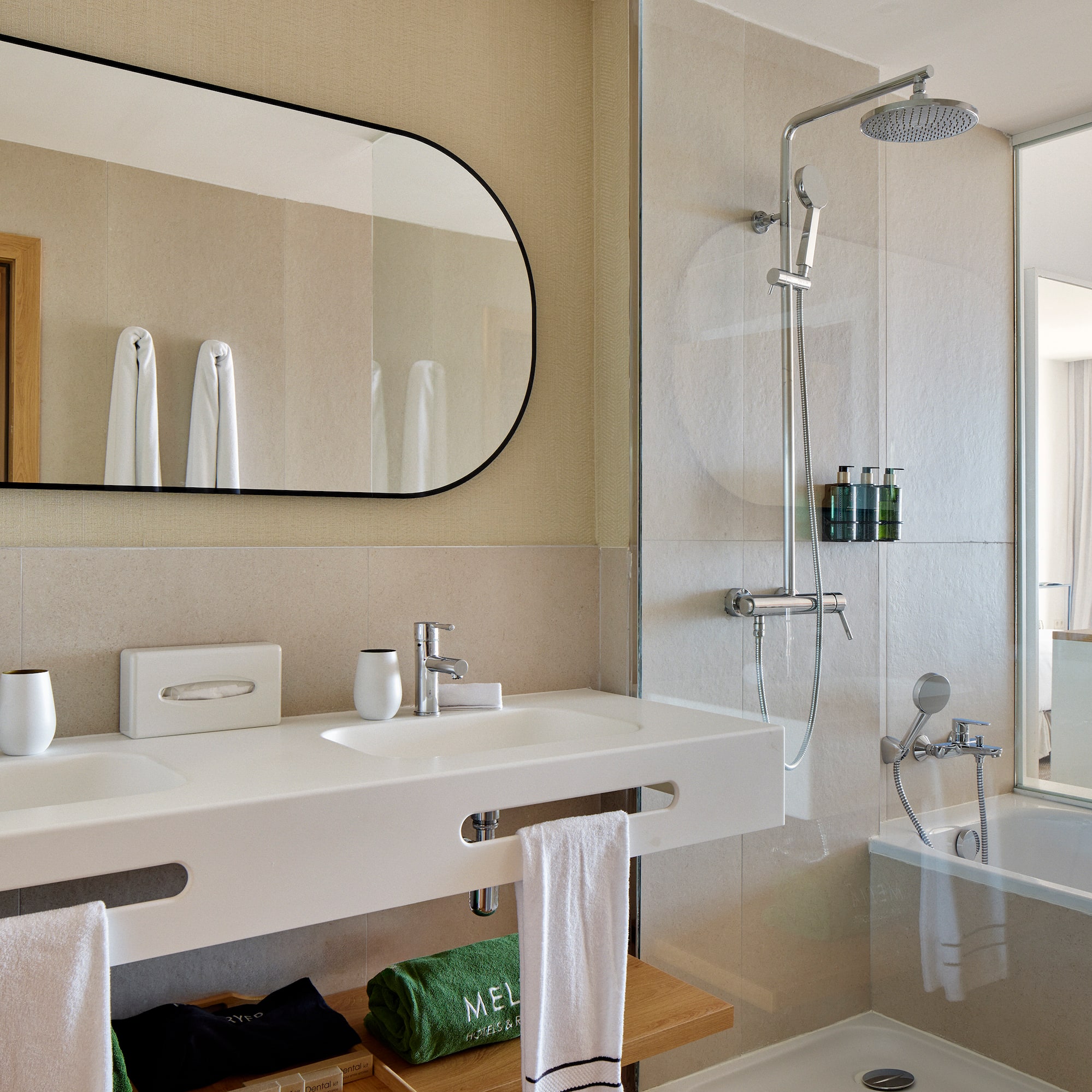 a bathroom with a shower and sink
