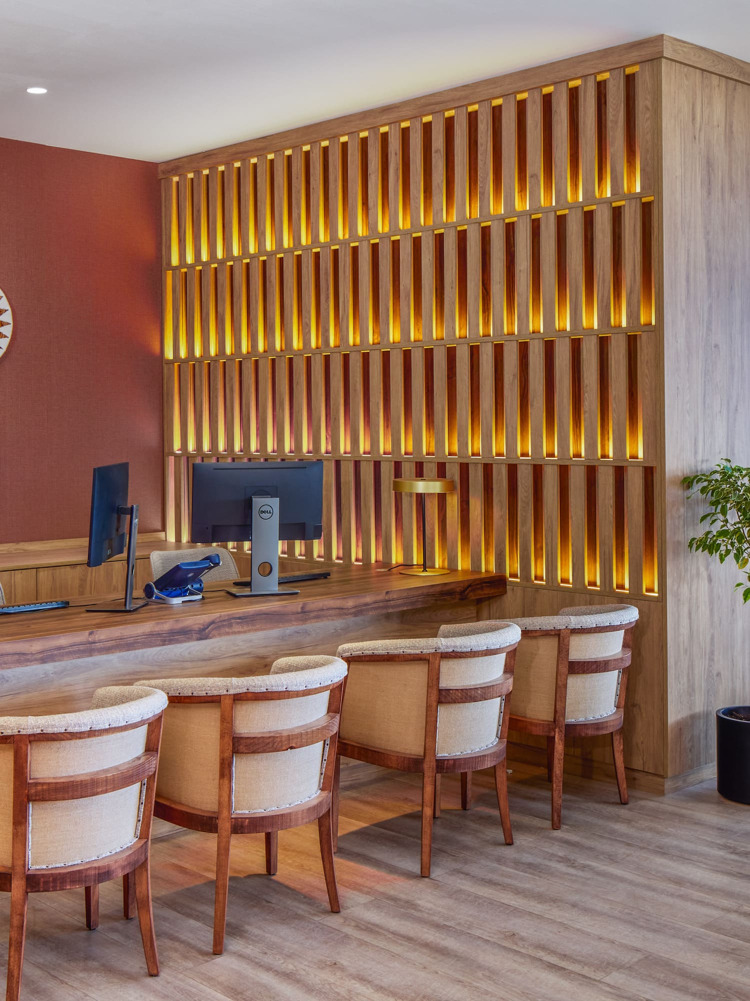 a room with a desk and chairs