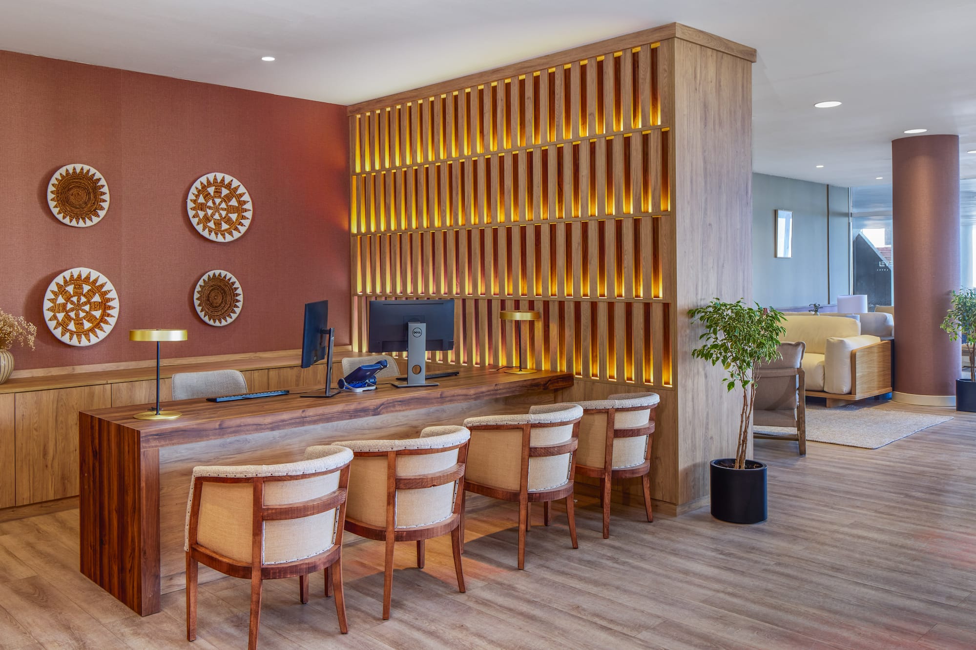 a room with a desk and chairs