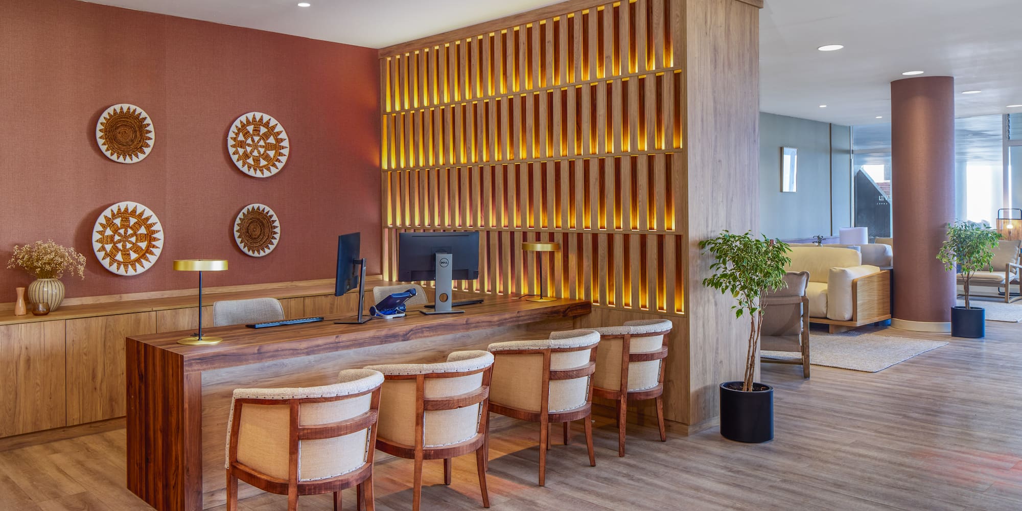 a room with a desk and chairs