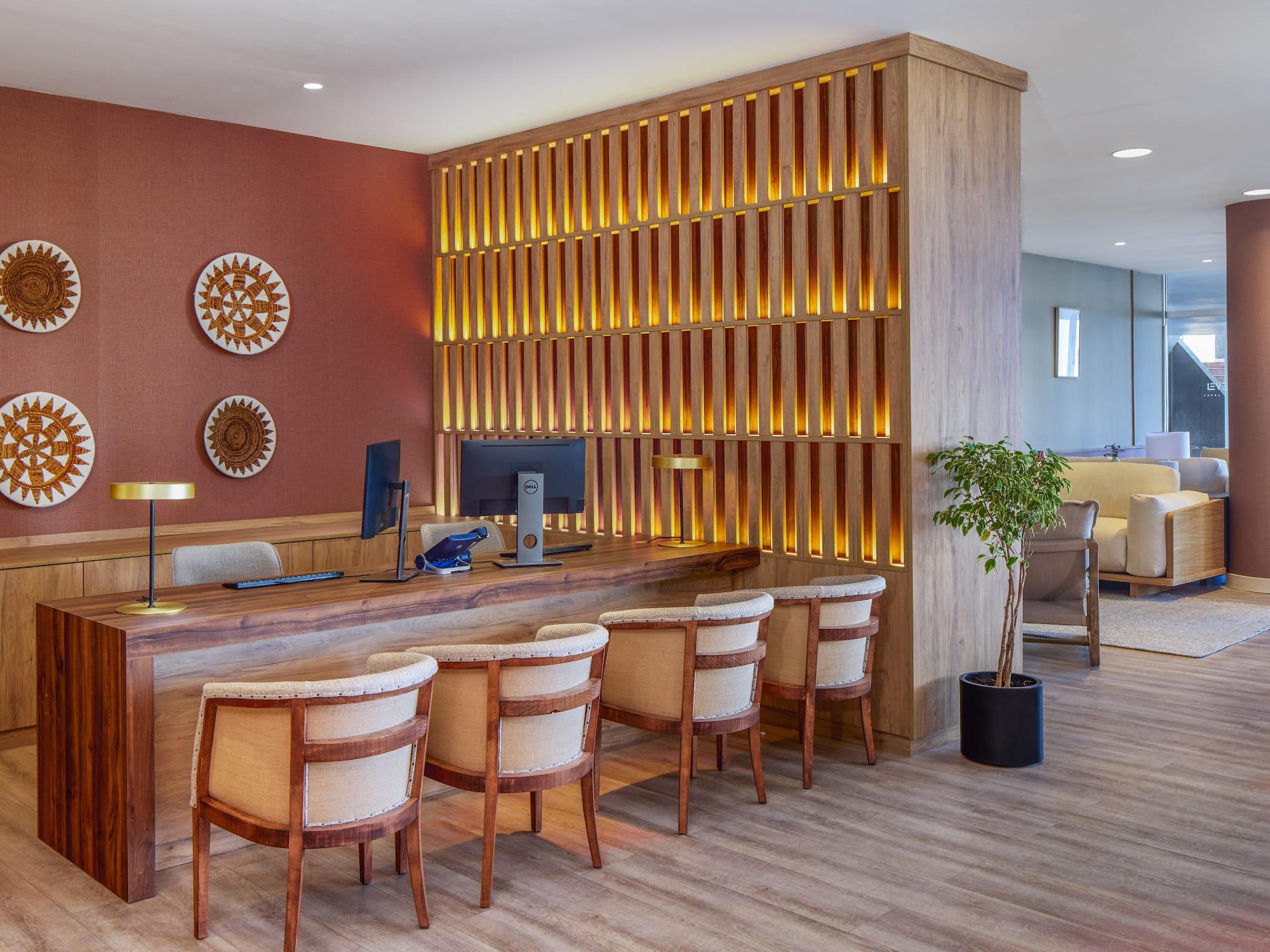 a room with a desk and chairs