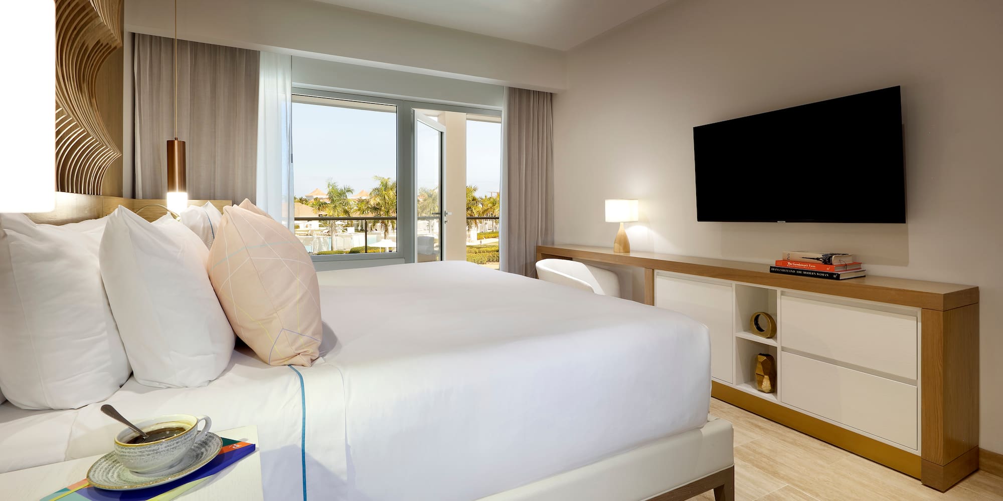 a bedroom with a television and a bed