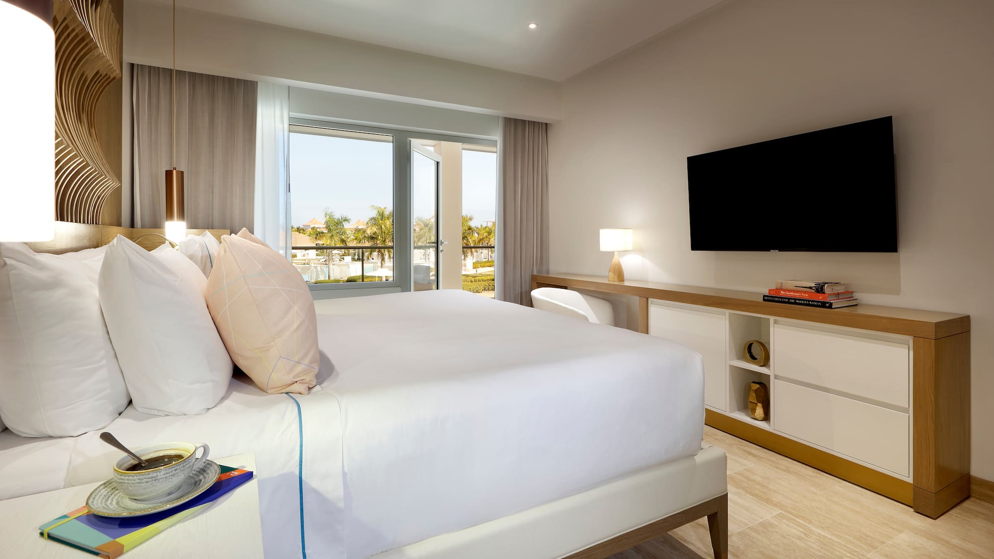 a bedroom with a television and a bed