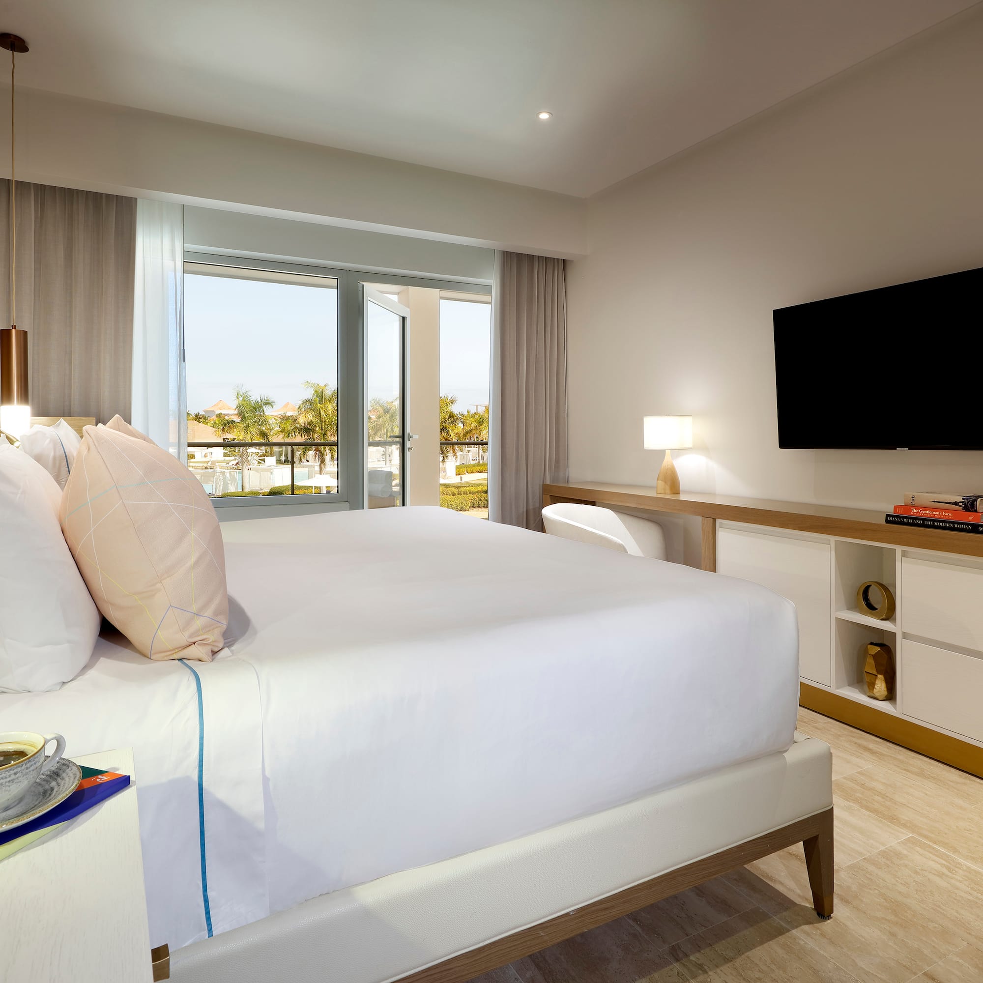 a bedroom with a television and a bed