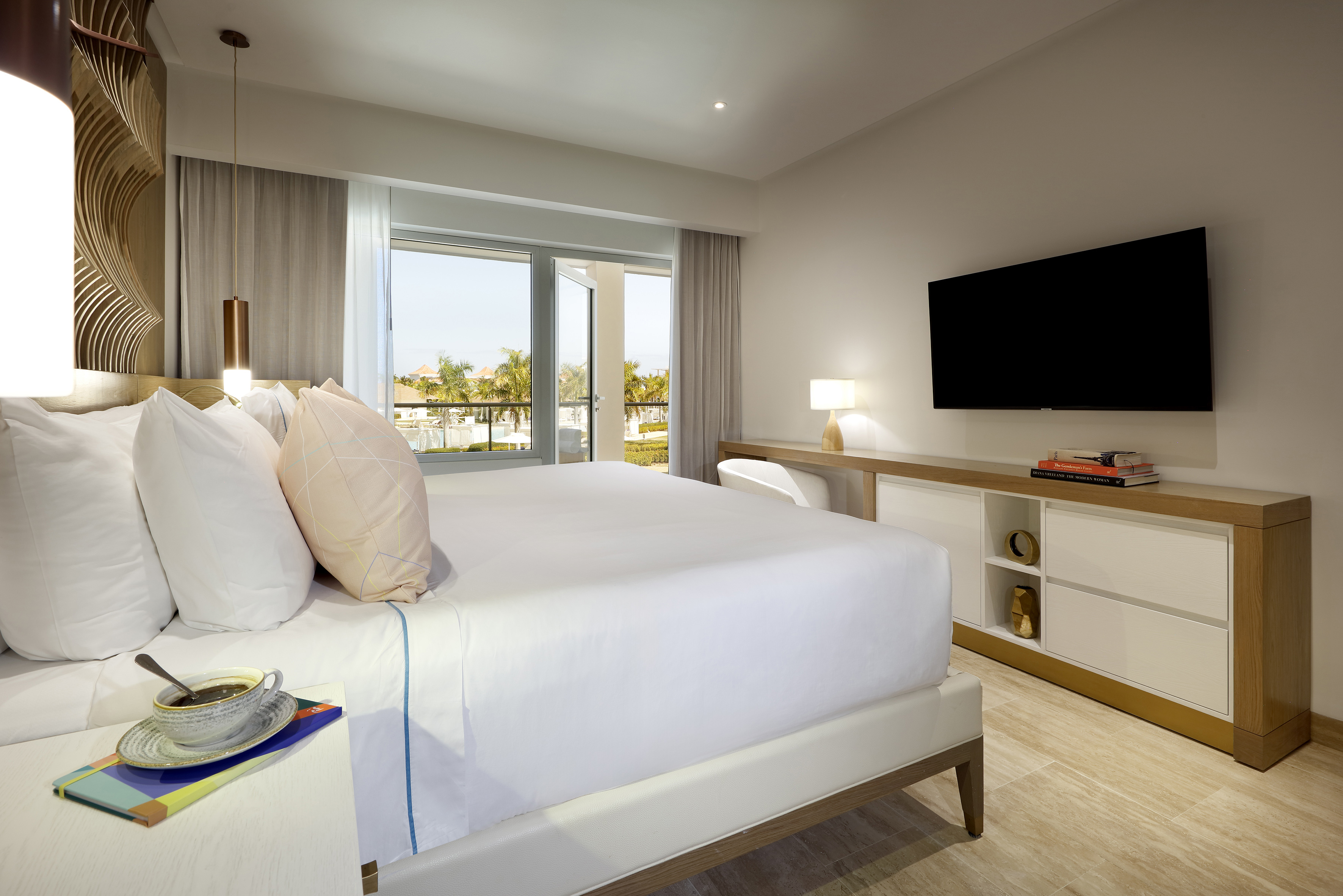 a bedroom with a television and a bed