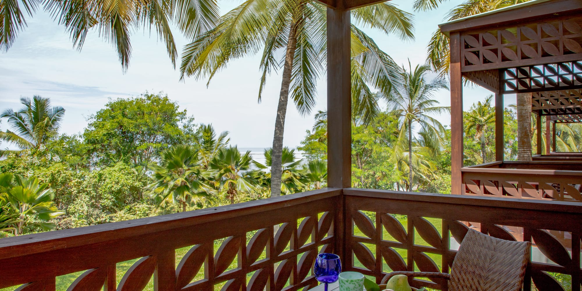 a table with fruit and a glass on it