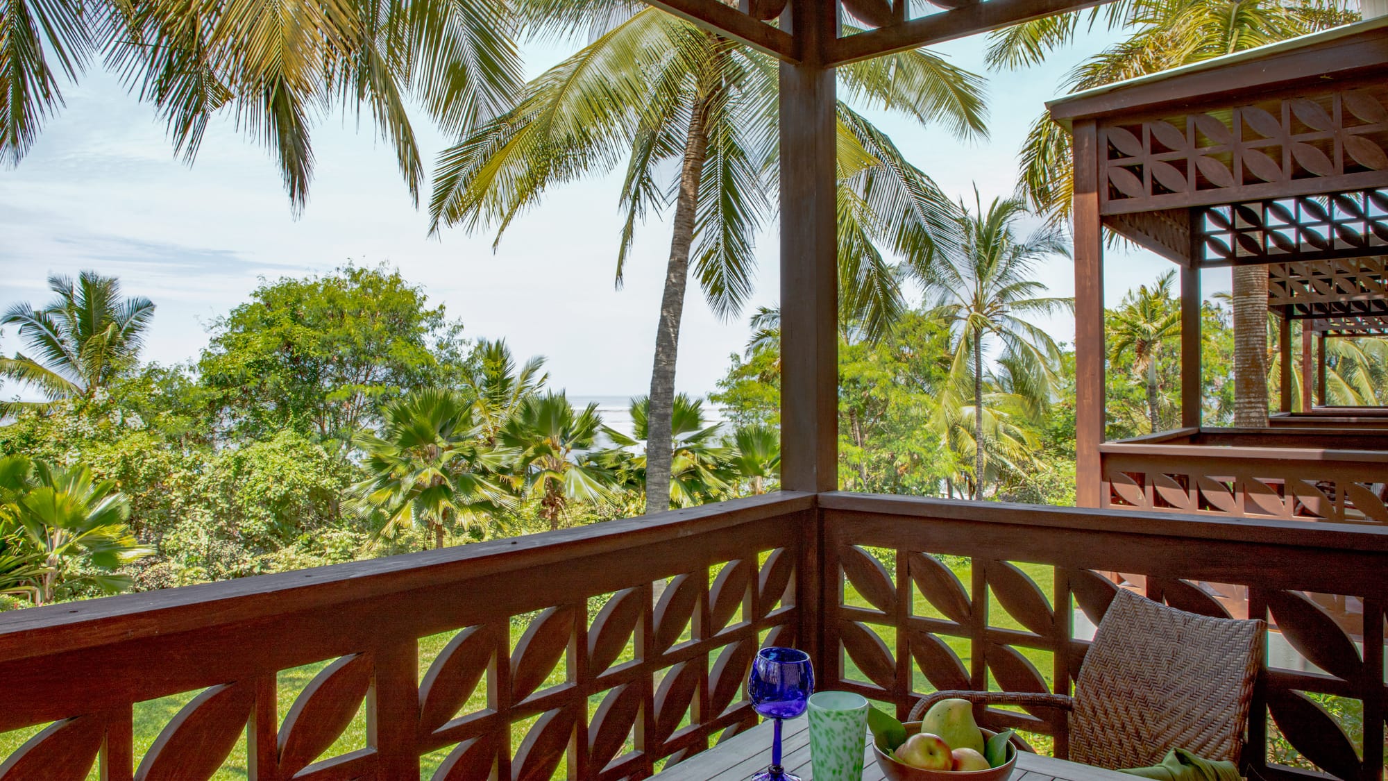 a table with fruit and a glass on it
