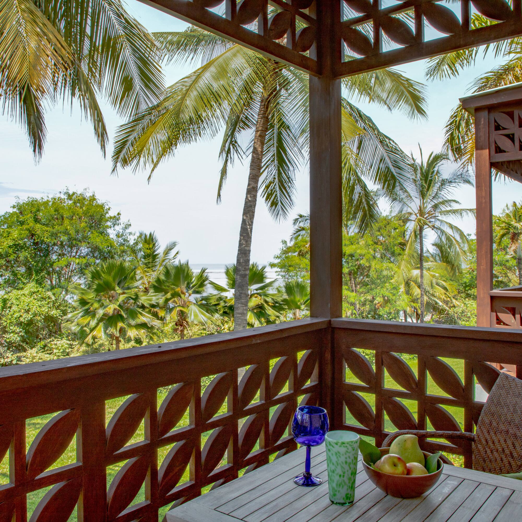a table with fruit and a glass on it