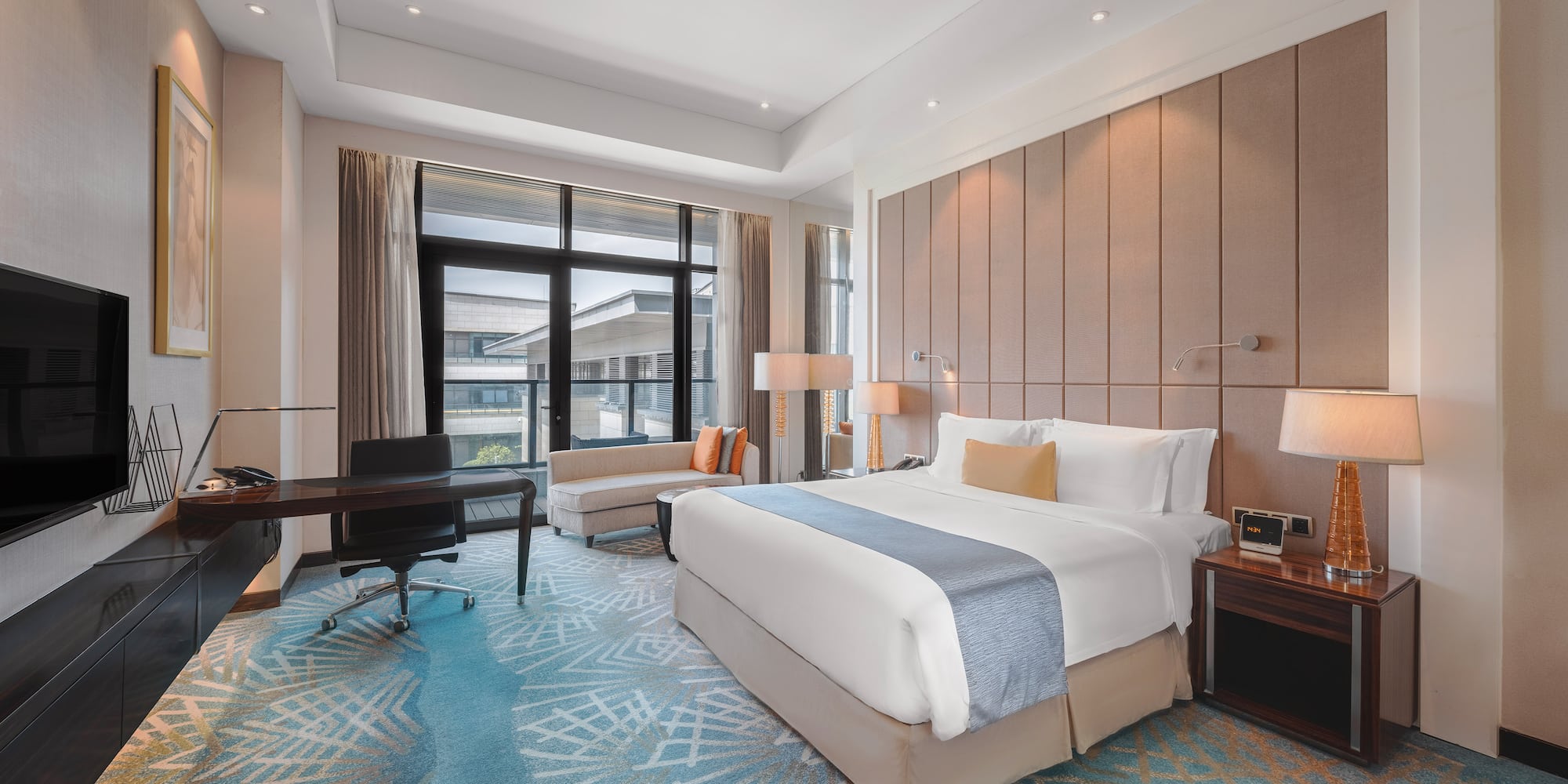 a room with a bed and a desk