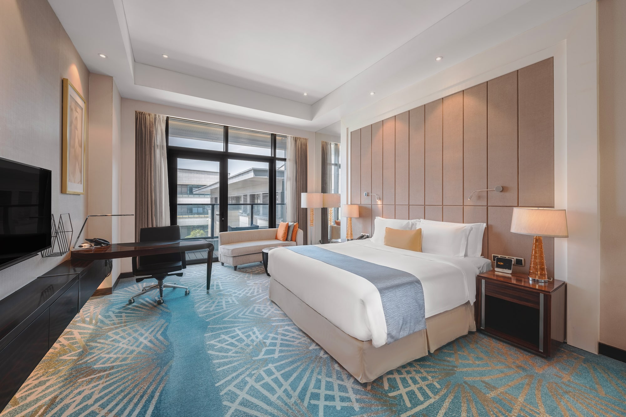 a room with a bed and a desk