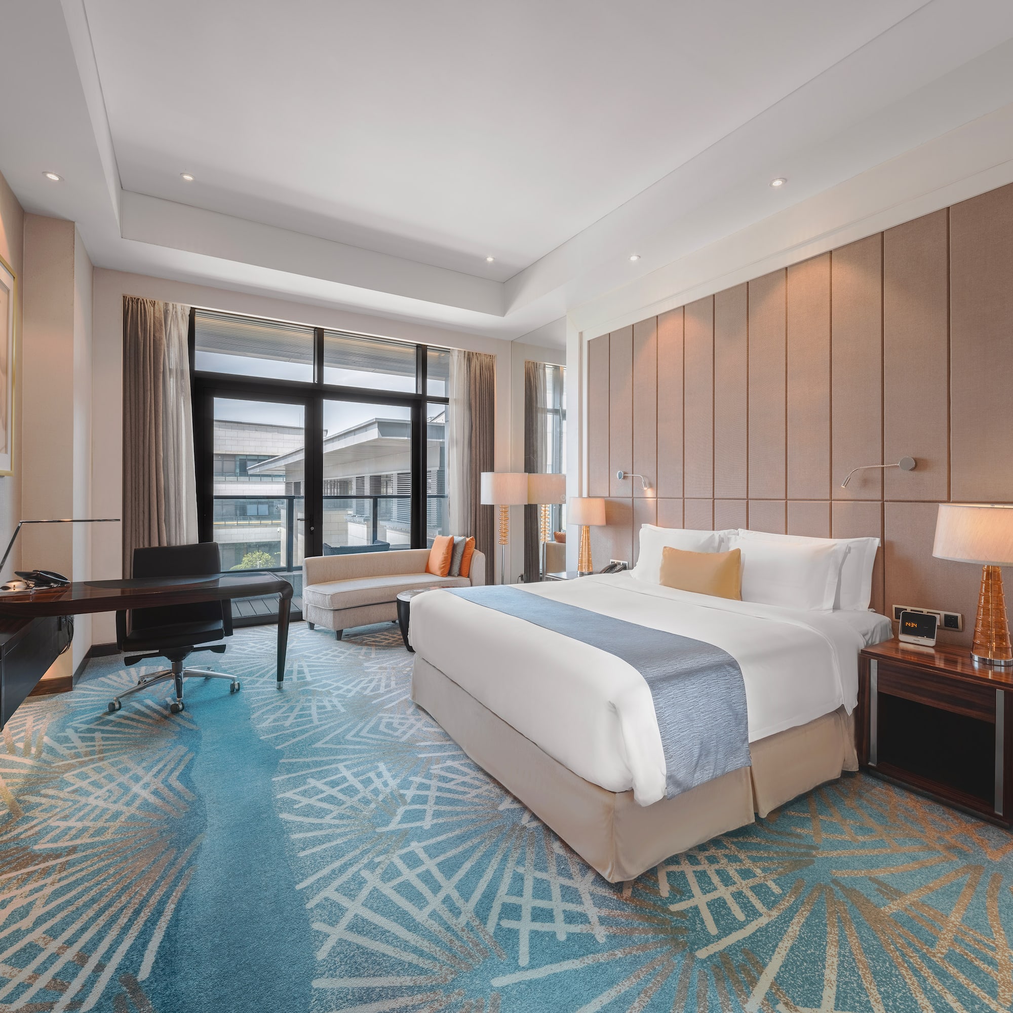 a room with a bed and a desk