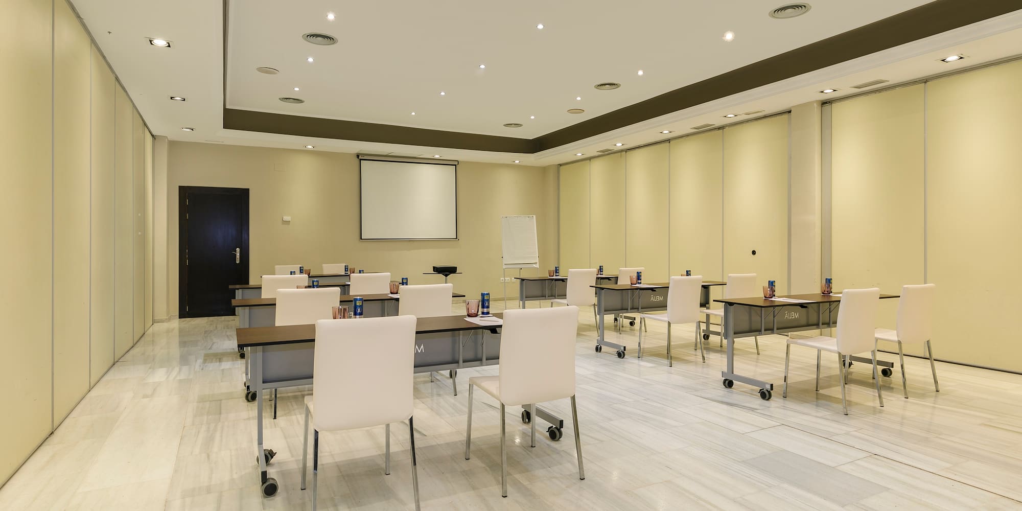 a room with tables and chairs