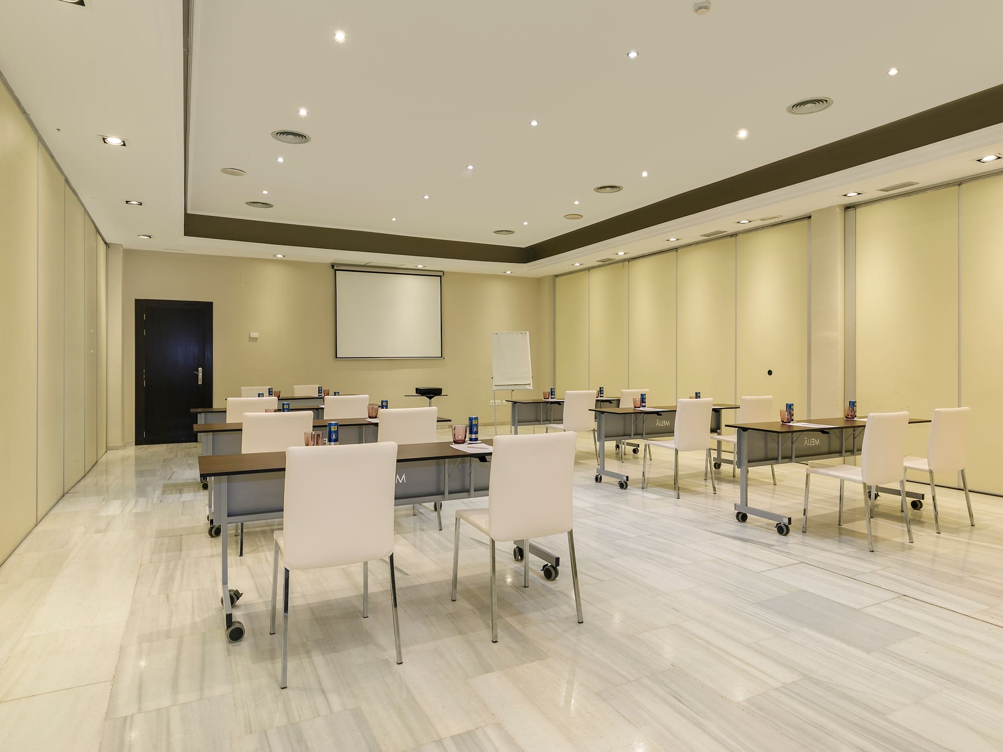 a room with tables and chairs