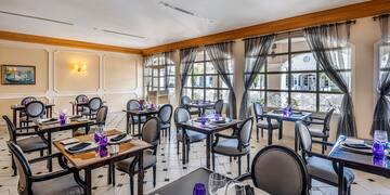 a room with tables and chairs