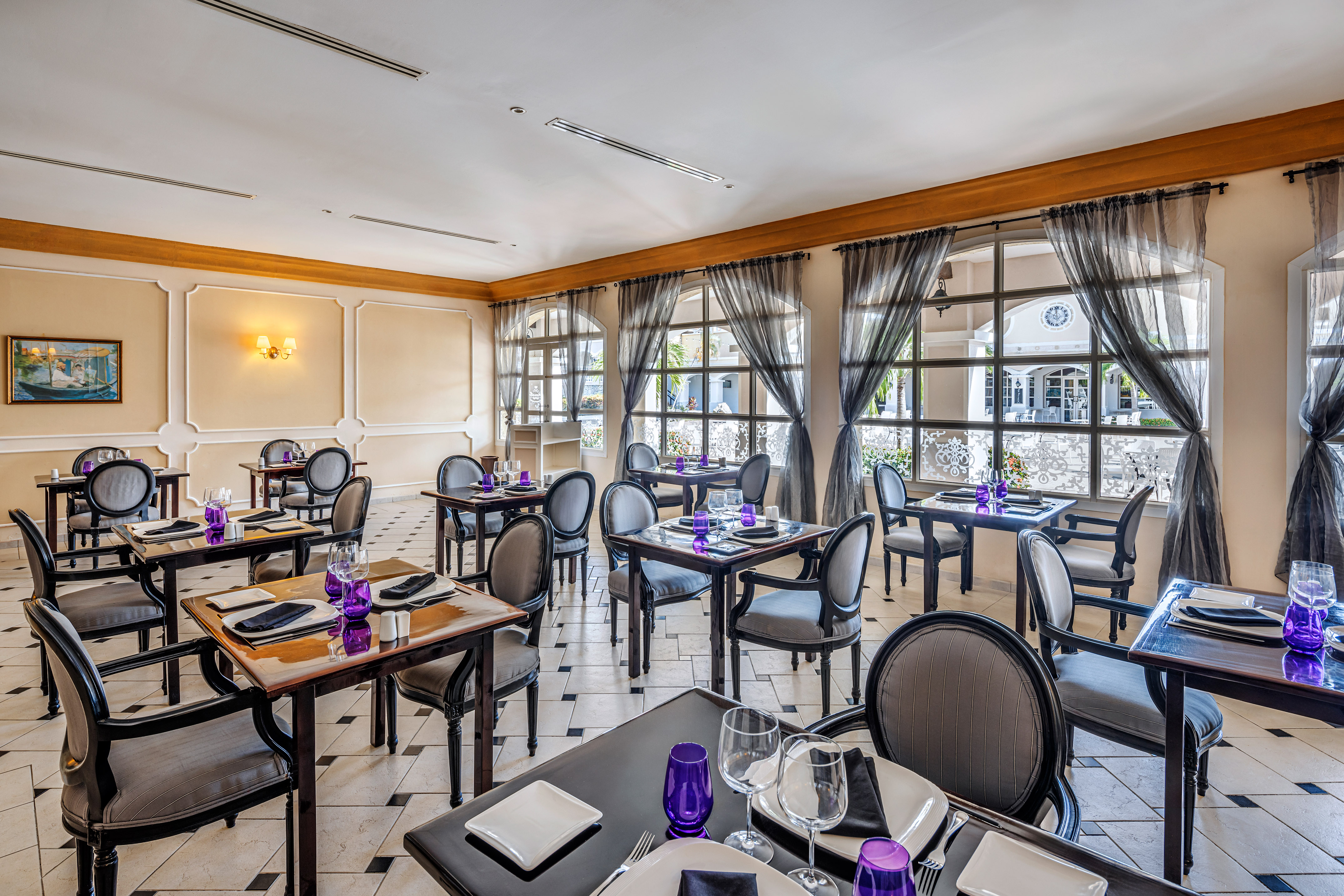 a room with tables and chairs