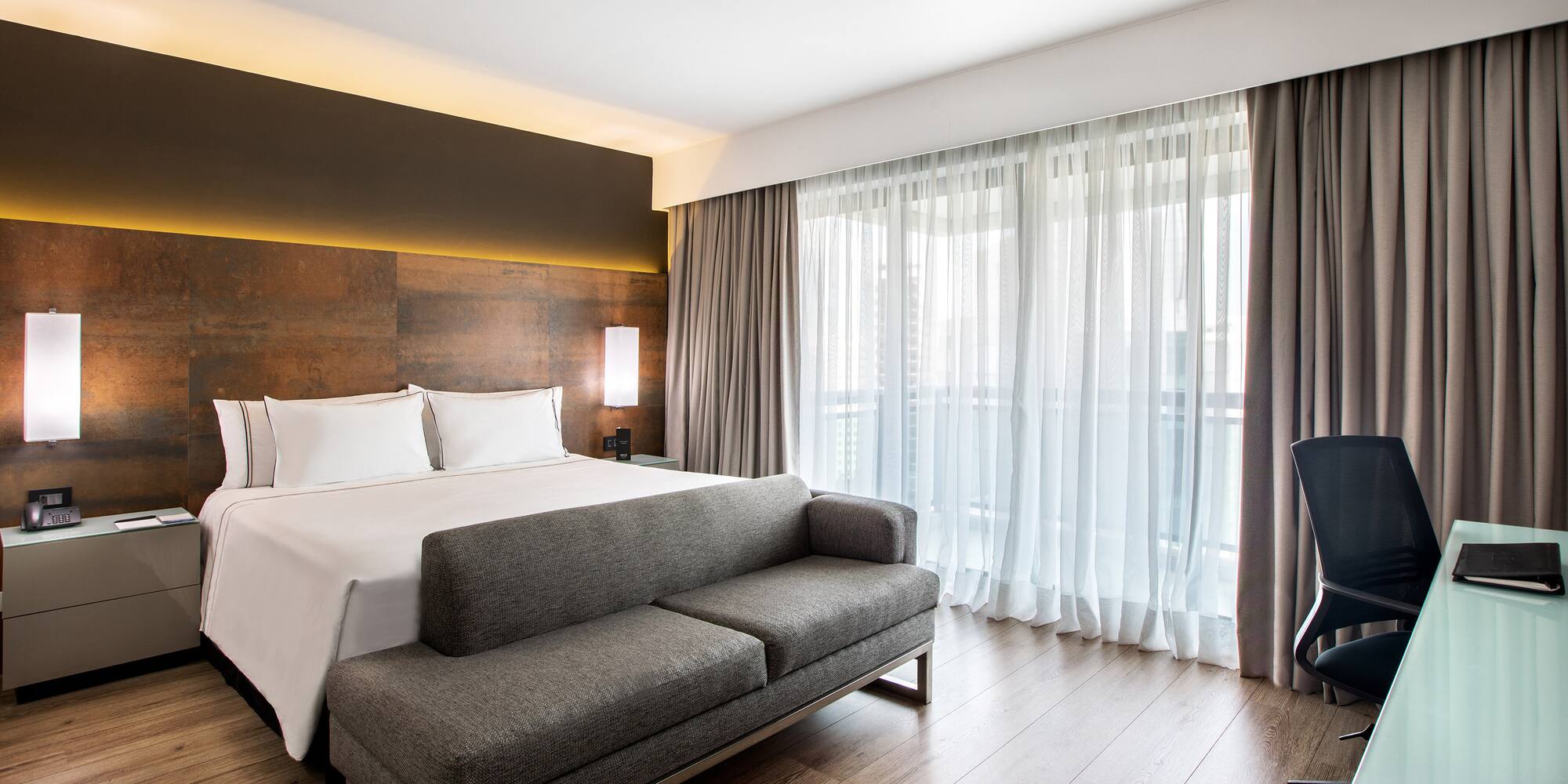 a bed and couch in a hotel room