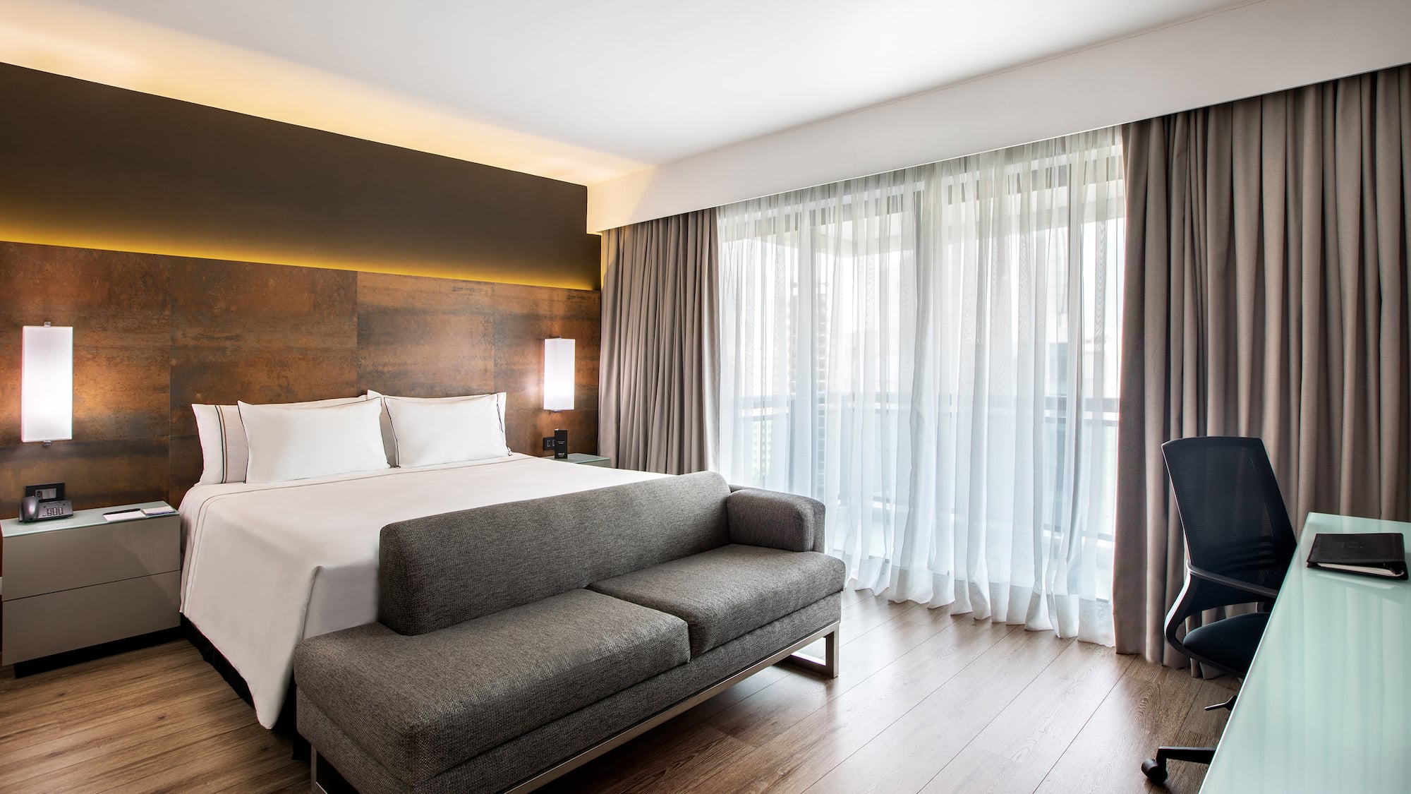 a bed and couch in a hotel room