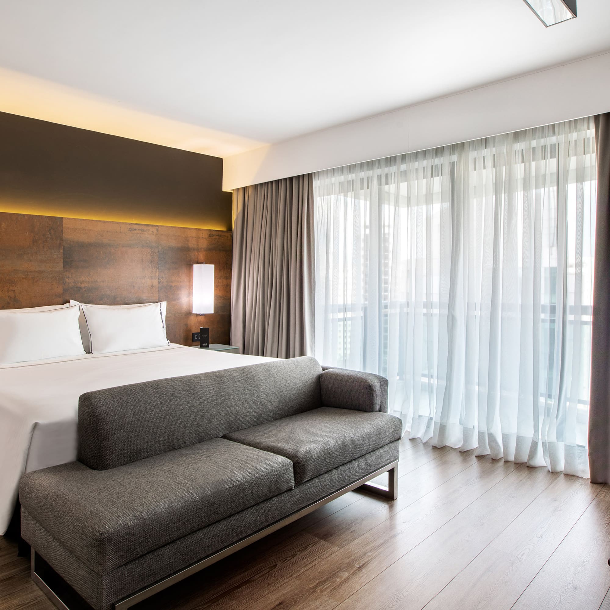 a bed and couch in a hotel room