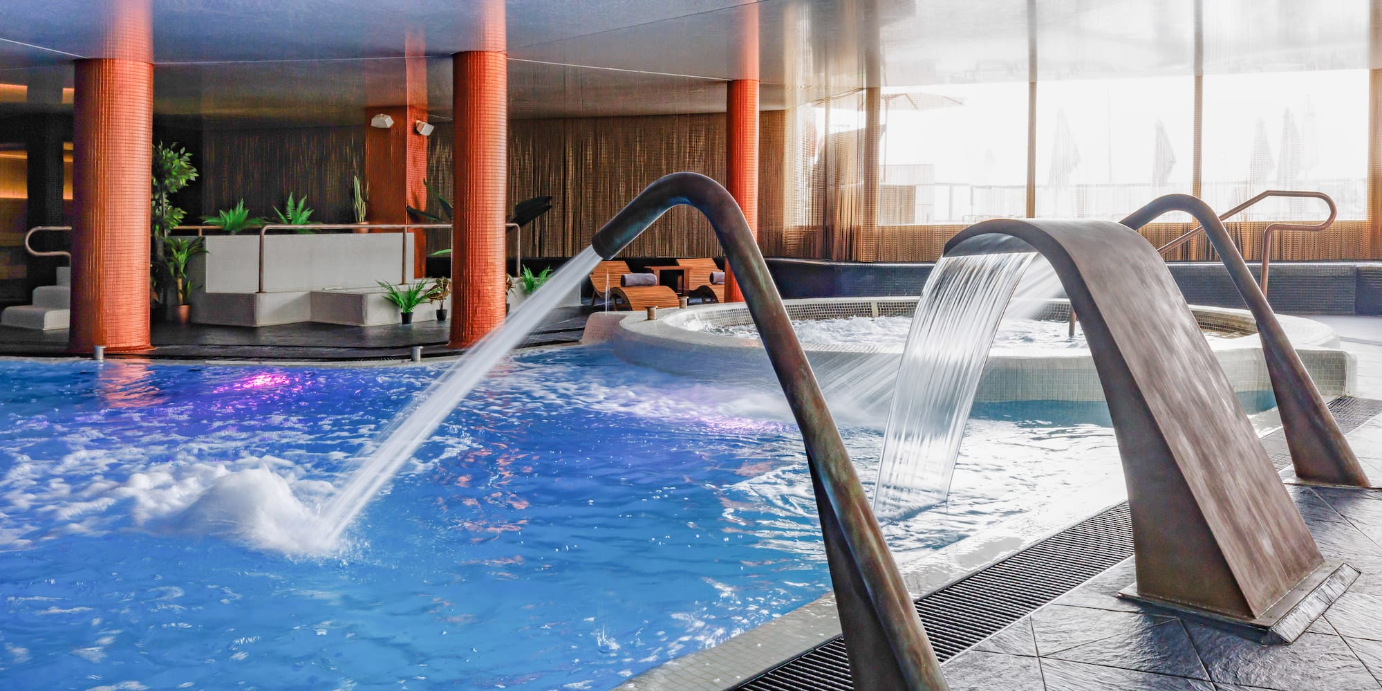 a pool with water pouring out of it