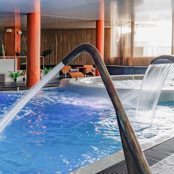 a pool with water pouring out of it
