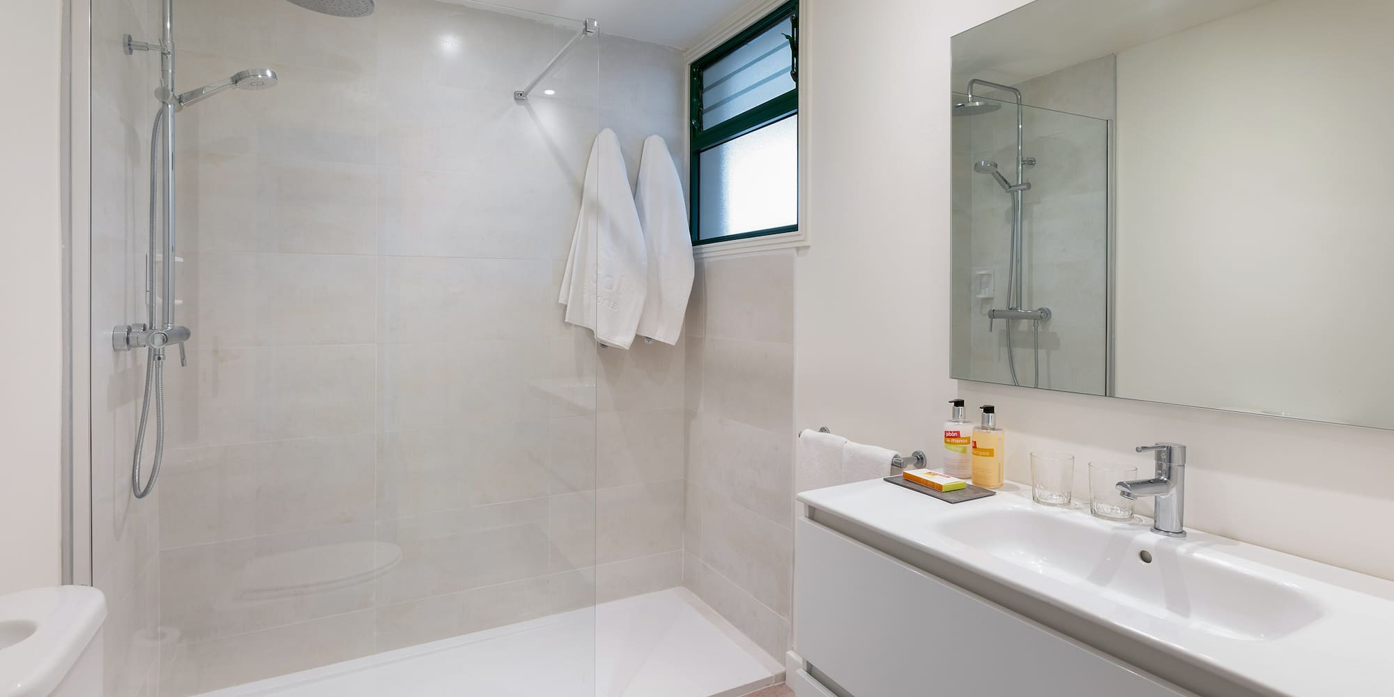 a bathroom with a shower and sink