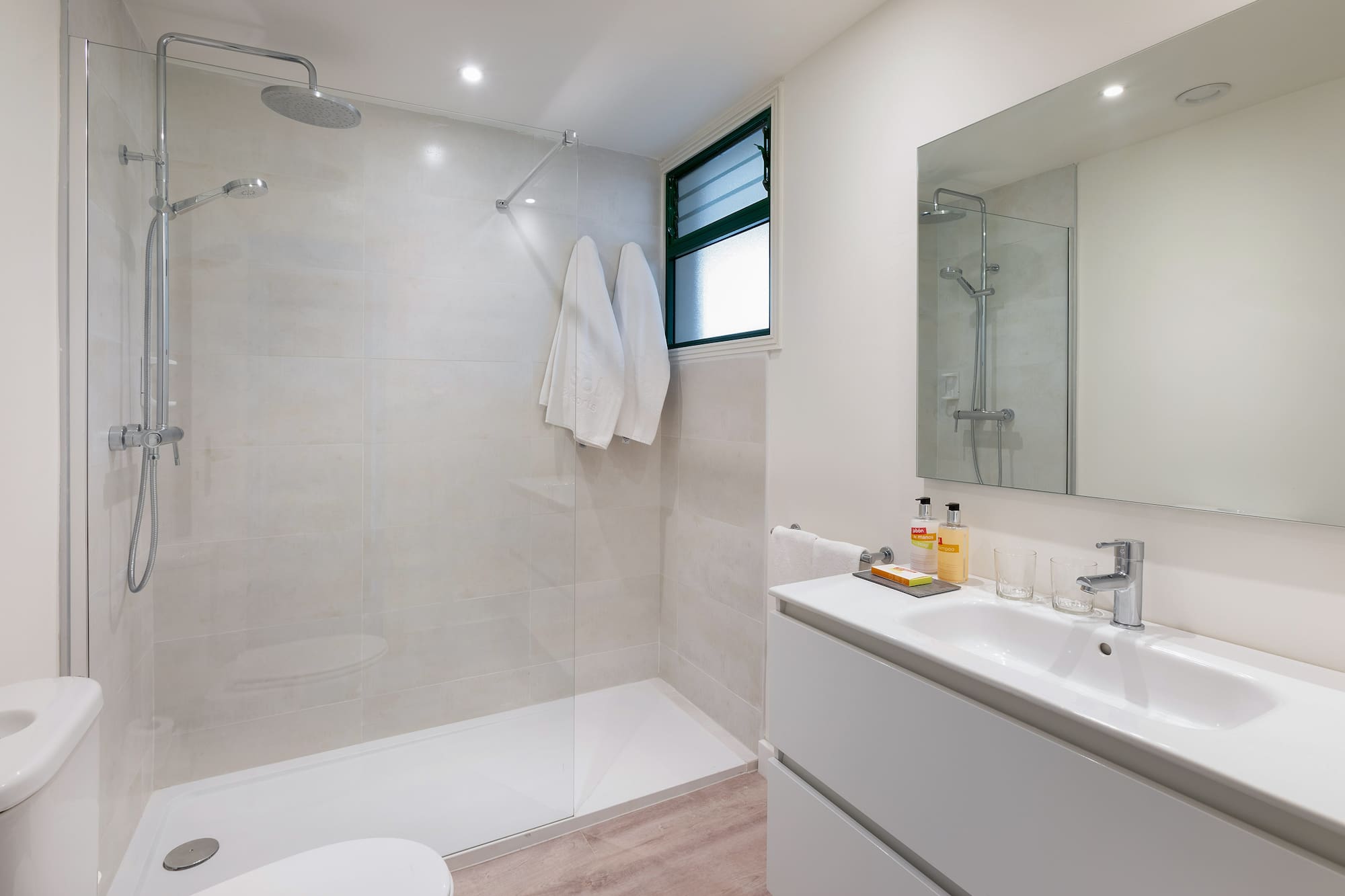 a bathroom with a shower and sink