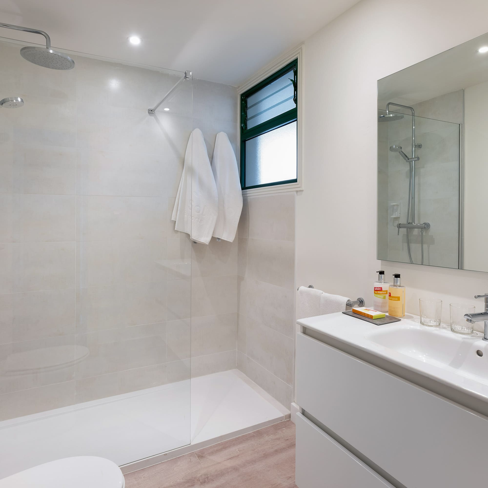 a bathroom with a shower and sink