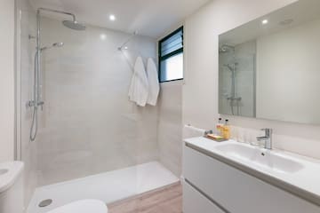 a bathroom with a shower and sink