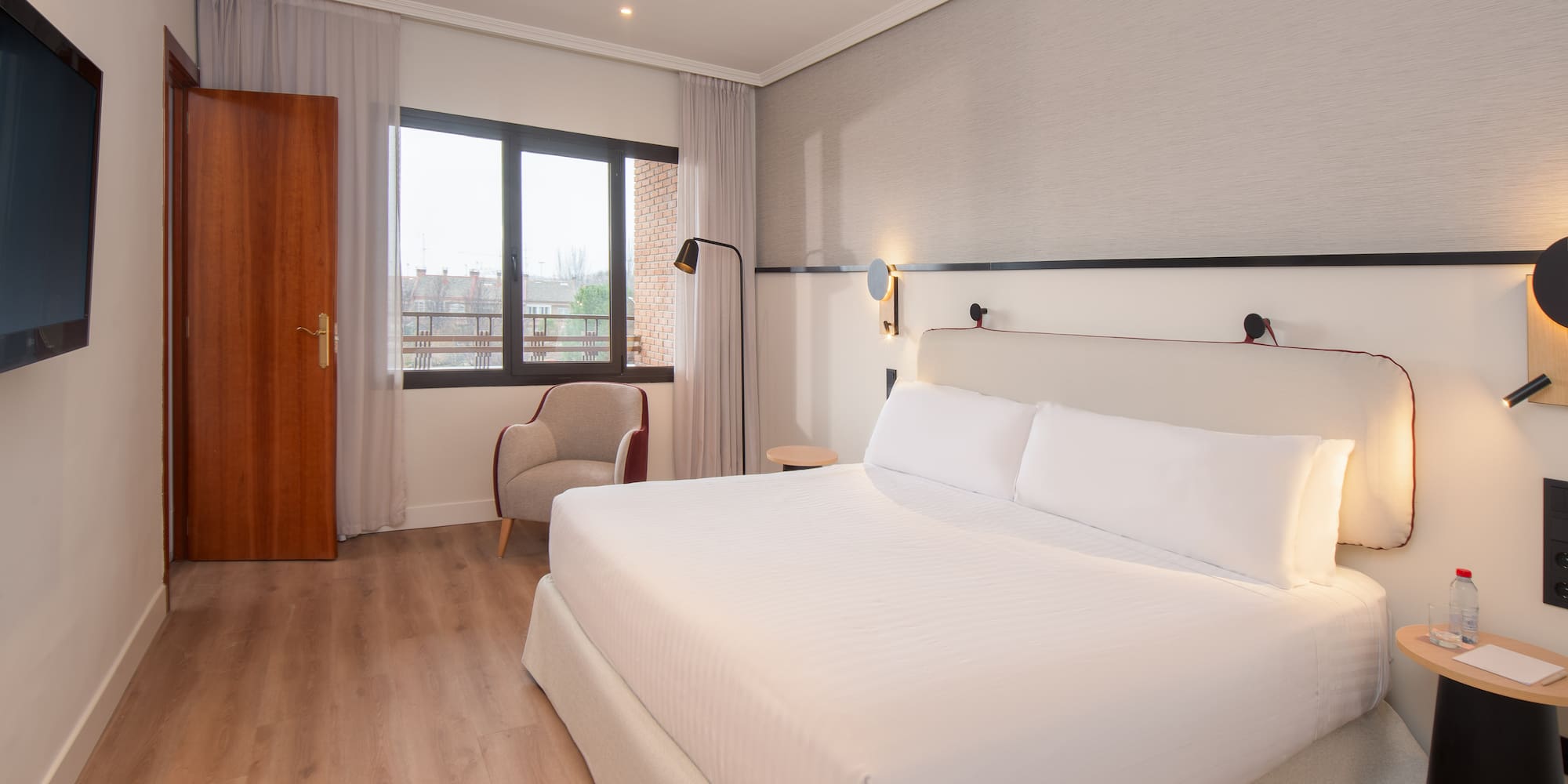 a room with a bed and a chair