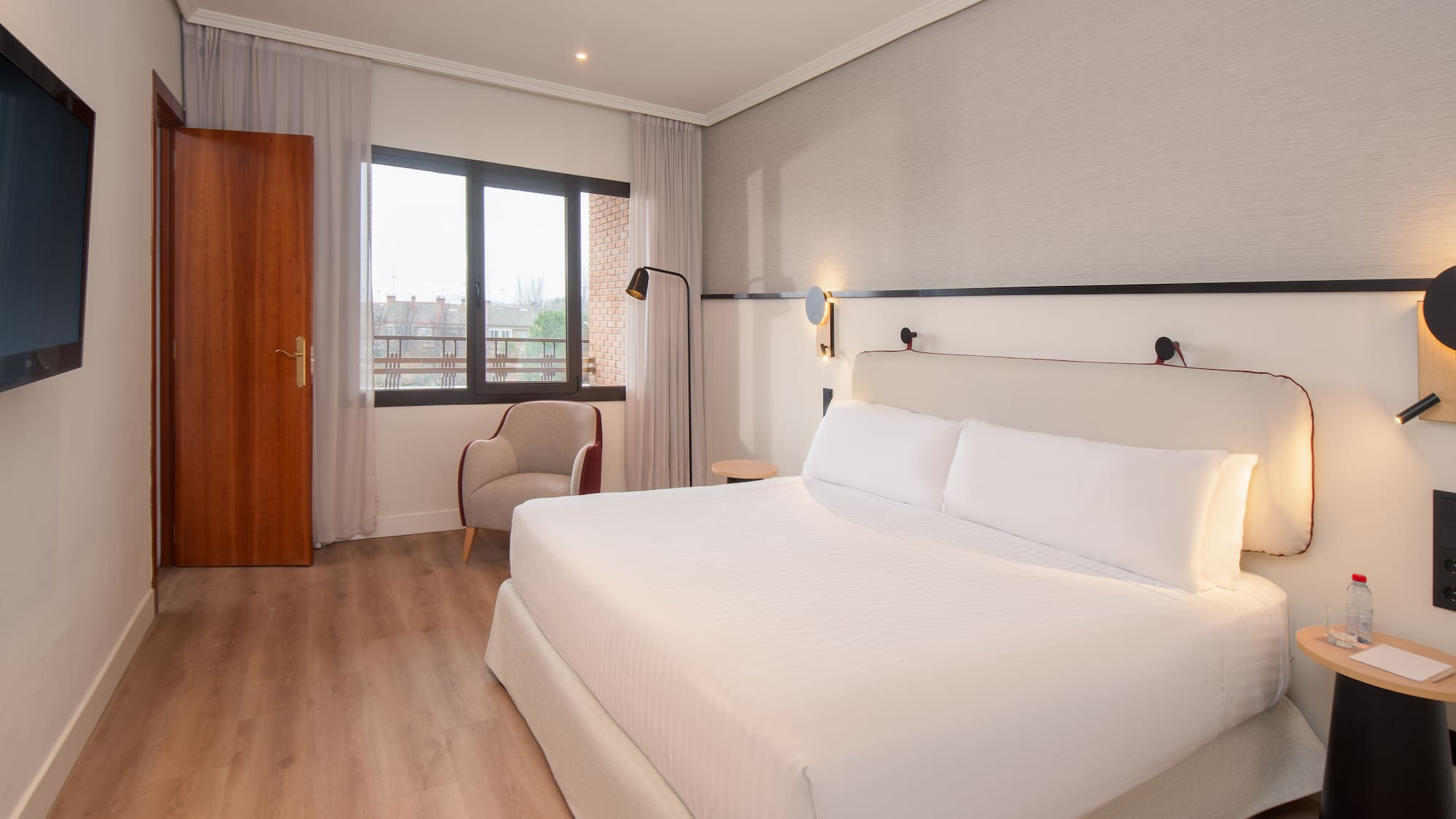 a room with a bed and a chair