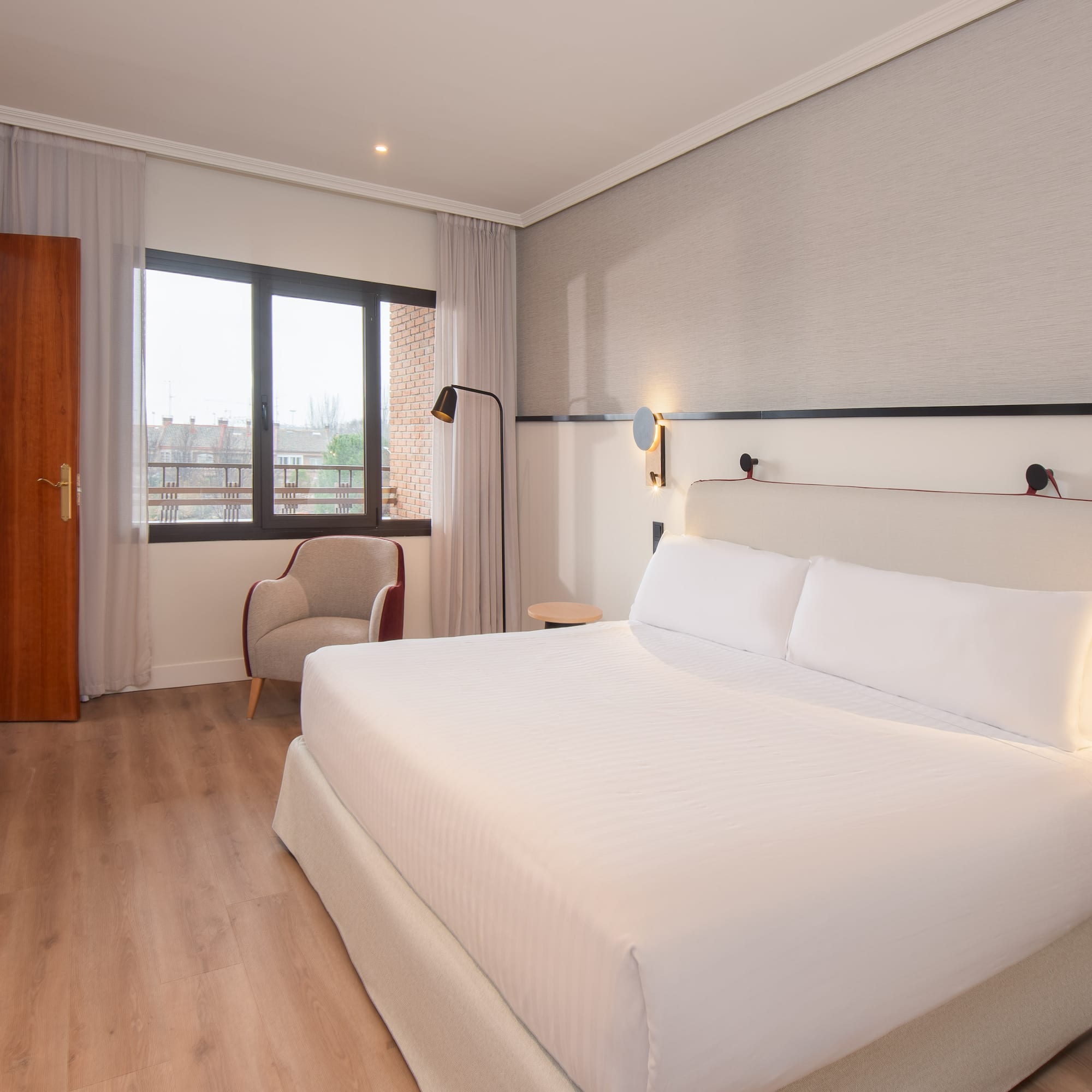 a room with a bed and a chair