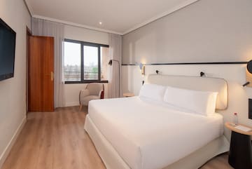 a room with a bed and a chair