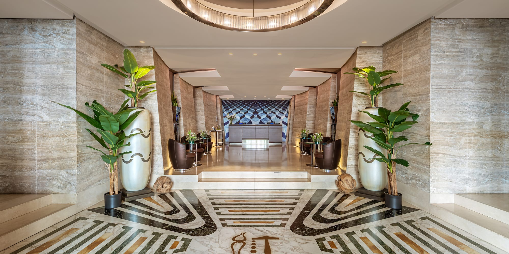 a hallway with plants and a marble floor
