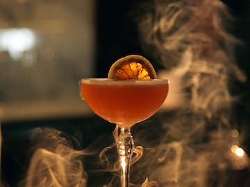 a glass with a drink in it