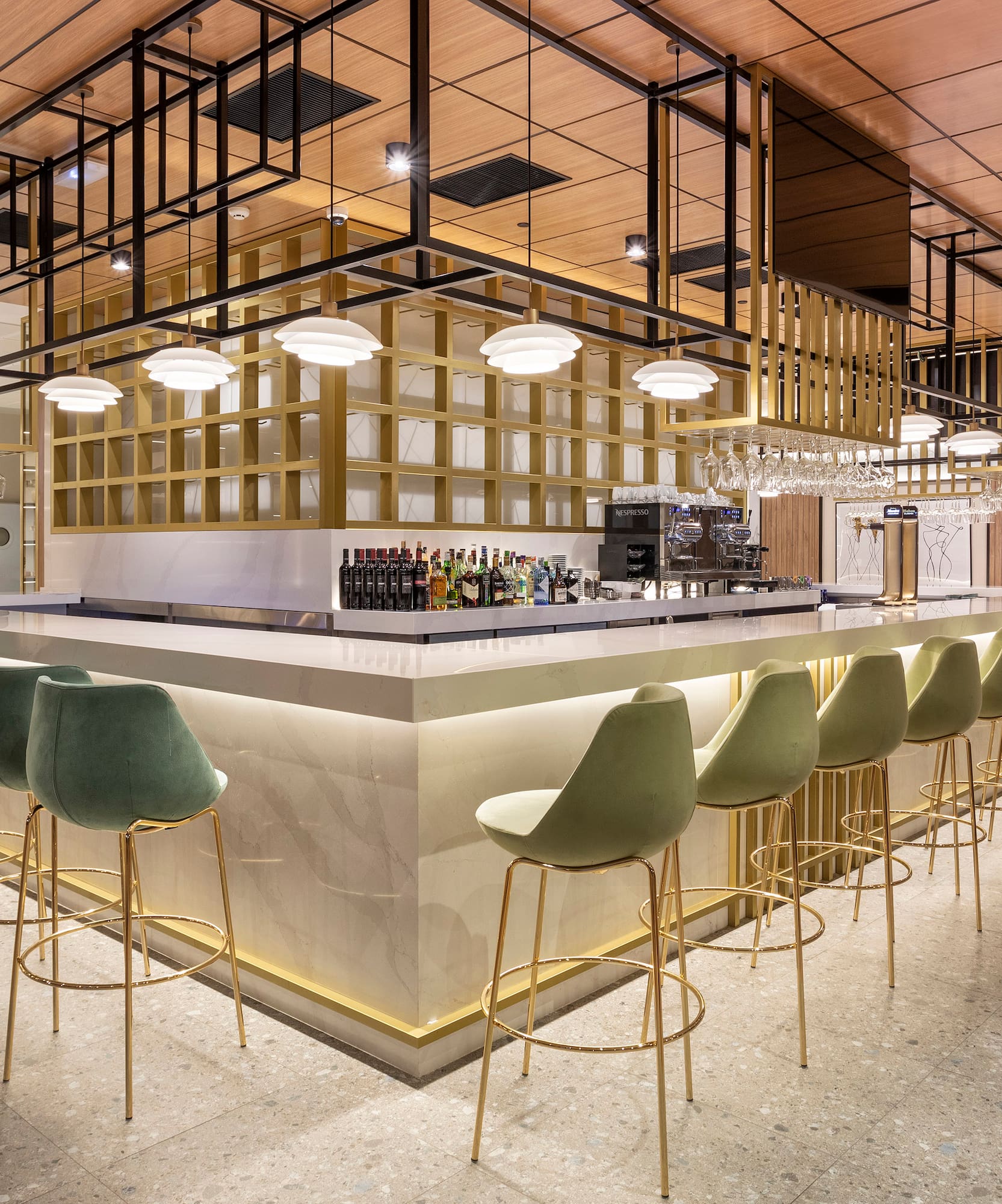 a bar with chairs and a counter