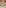 Modern commercial bar with green velvet stools, sleek counter, and gold details.