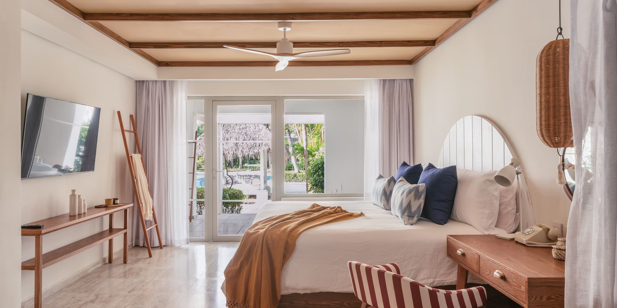 a bedroom with a bed and a desk