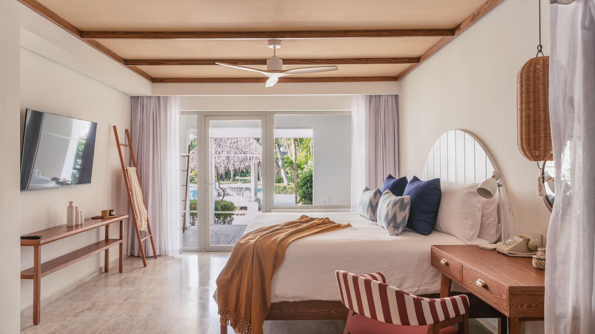 a bedroom with a bed and a desk