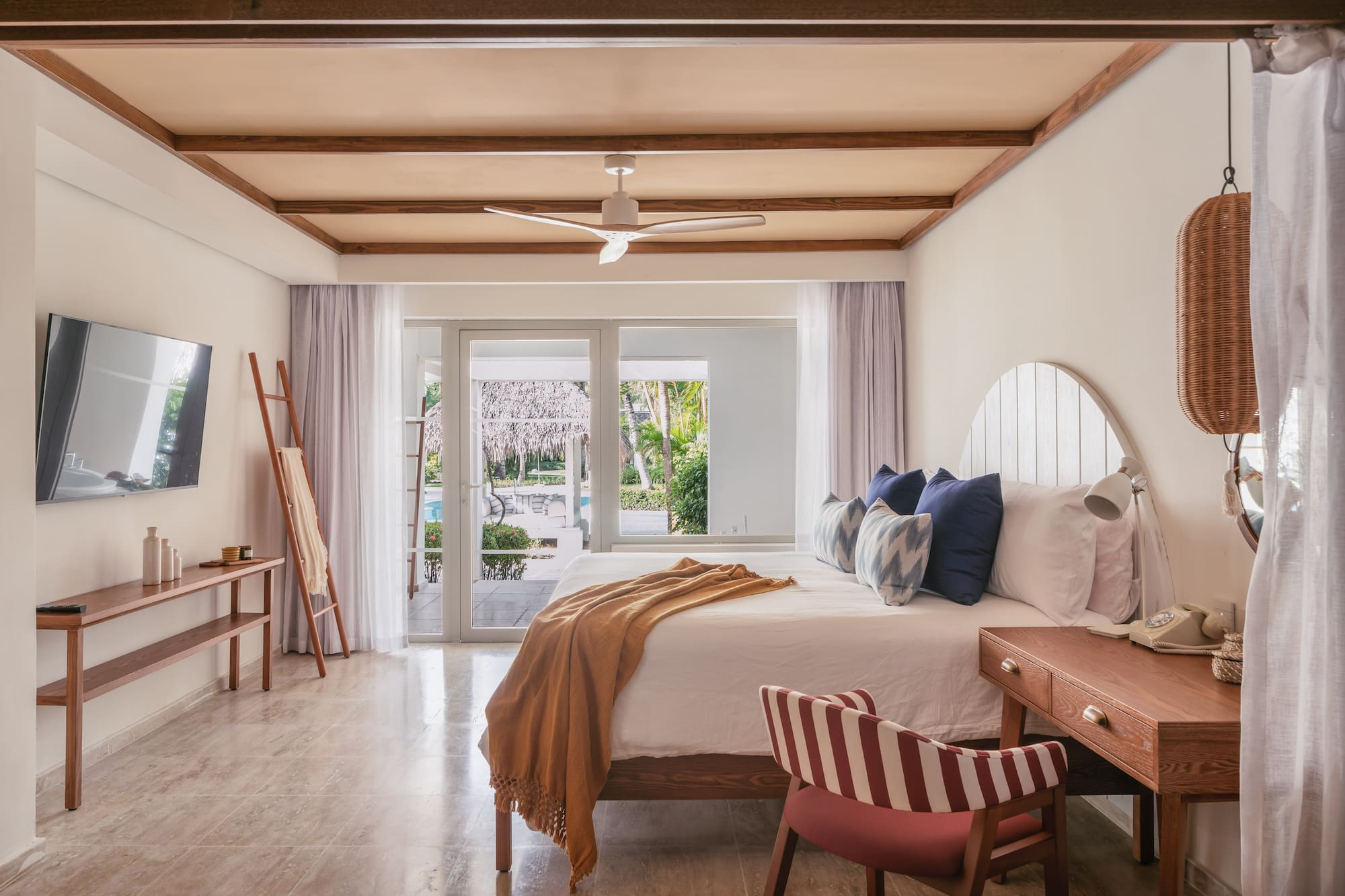 a bedroom with a bed and a desk