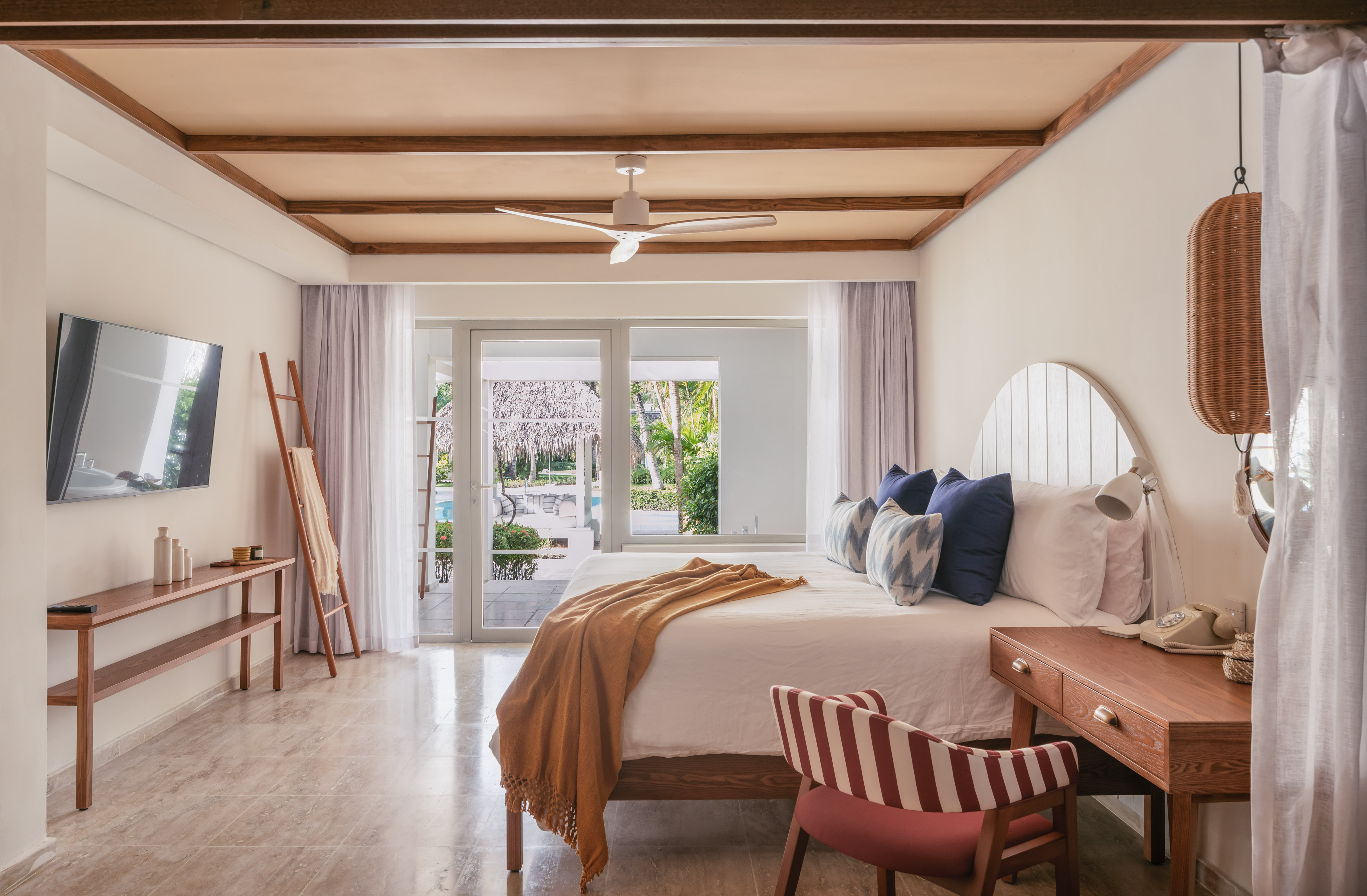 a bedroom with a bed and a desk