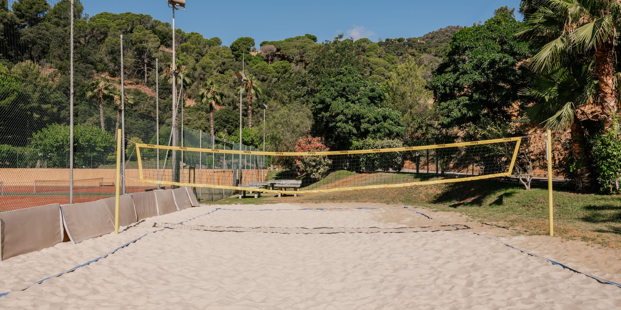 a volleyball court with a yellow net