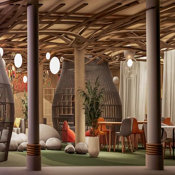 a room with a large area with chairs and tables