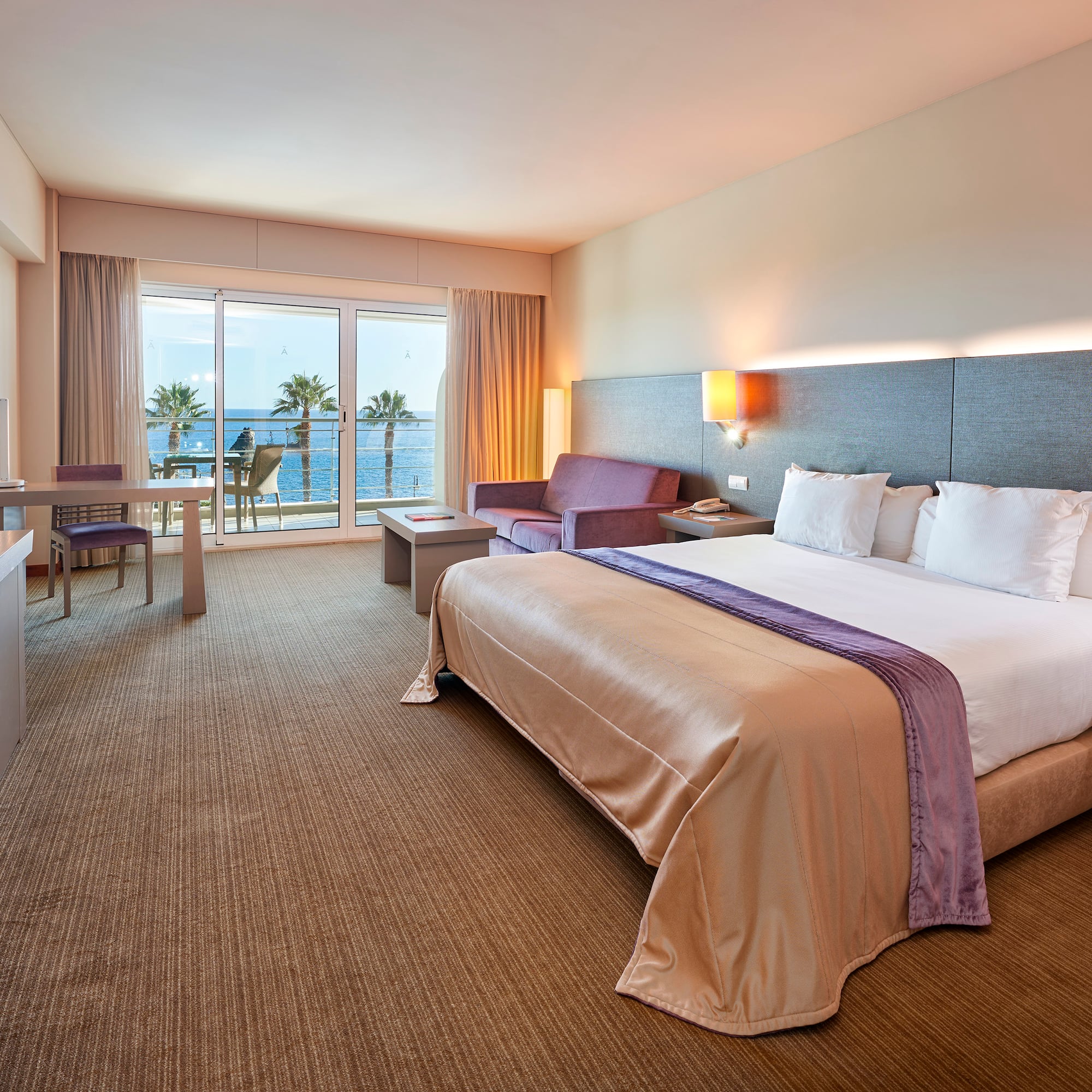 a hotel room with a bed and a television