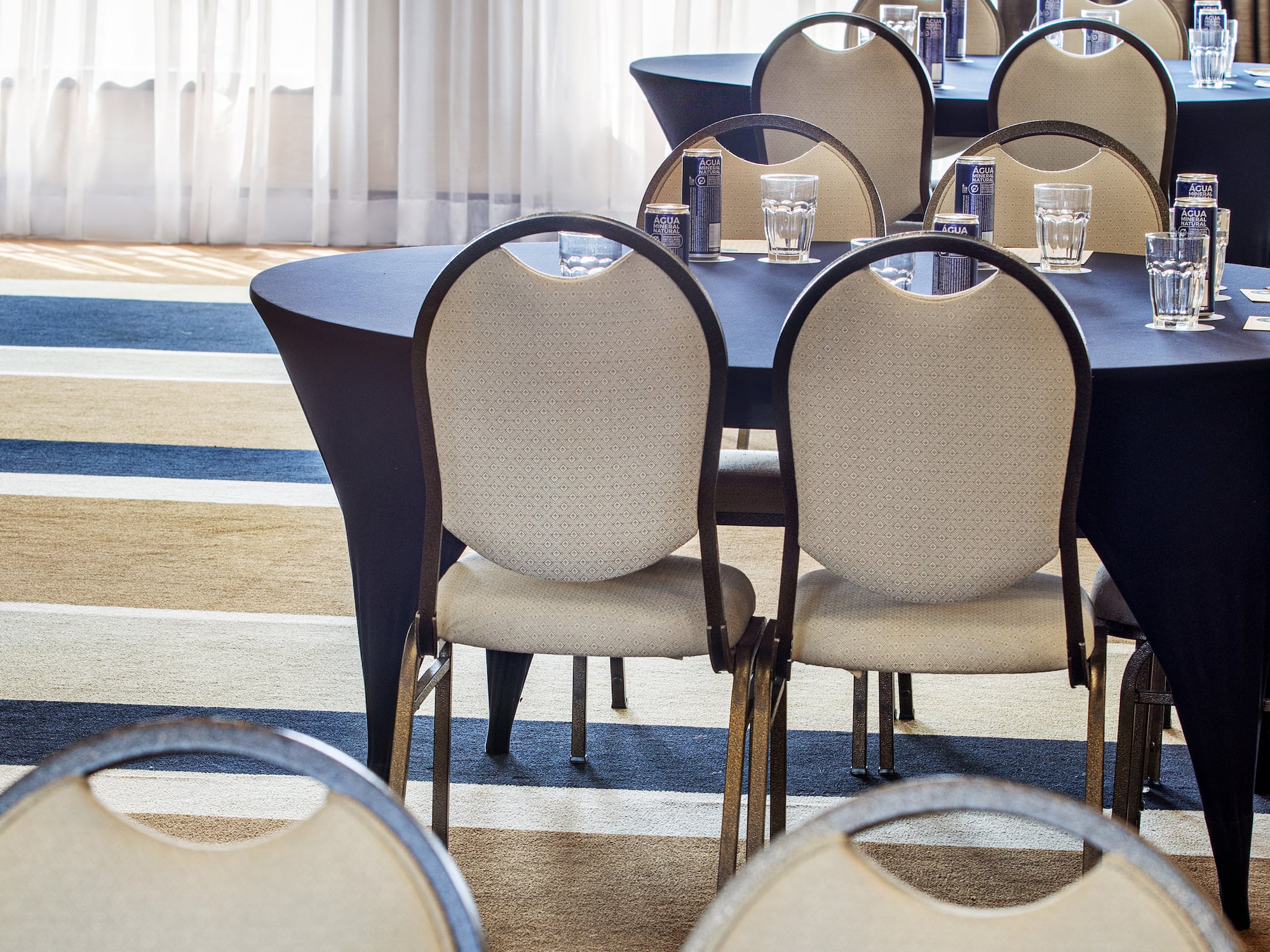 a group of tables and chairs in a room