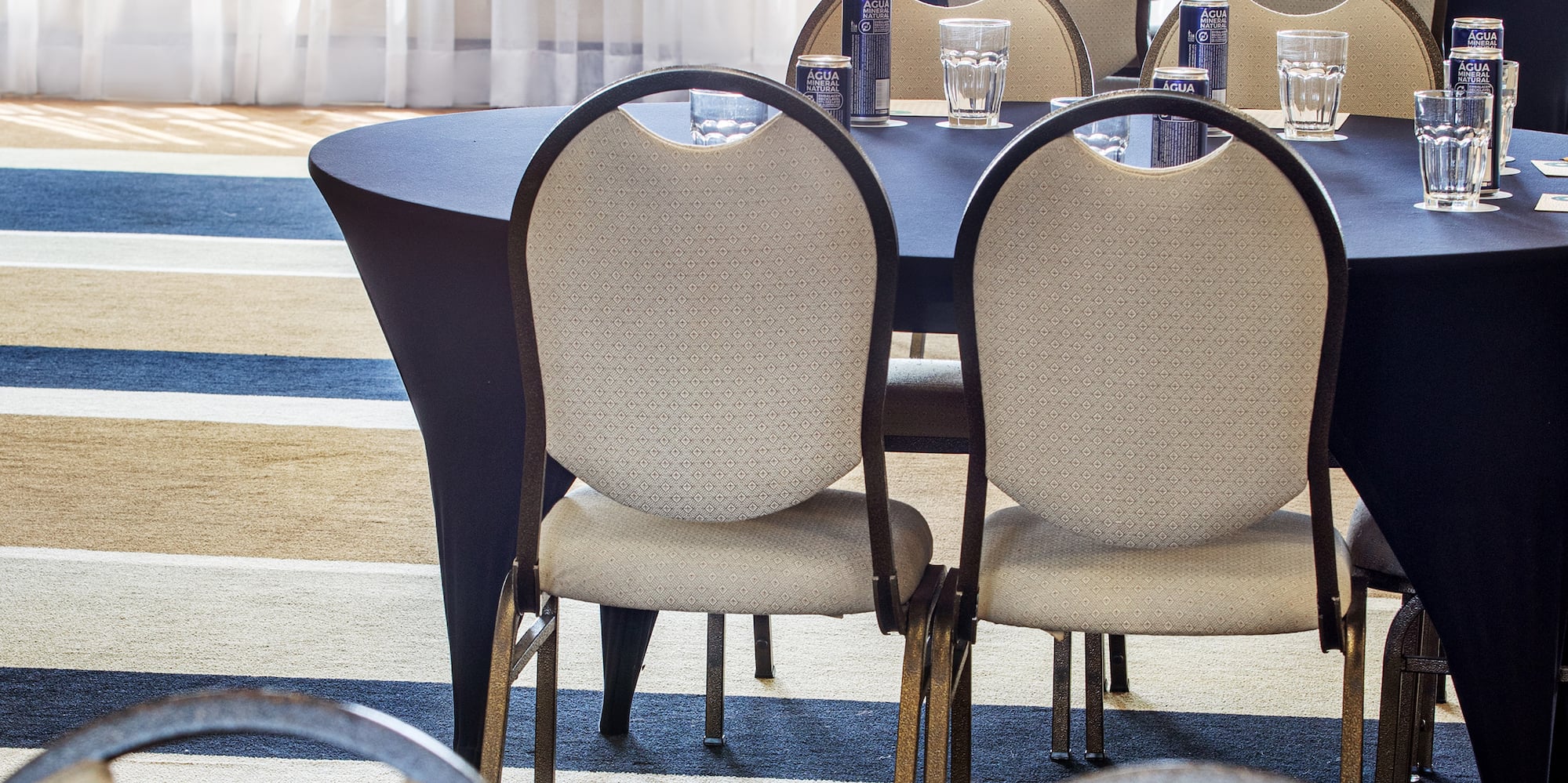 a group of tables and chairs in a room