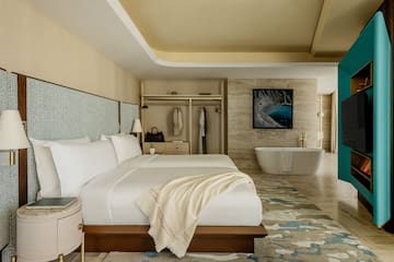 a room with a bed and bathtub