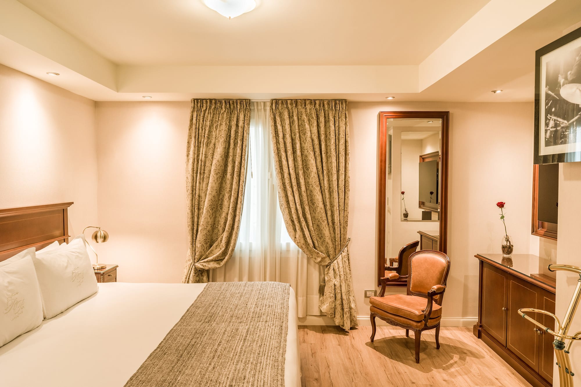 a bedroom with a bed and a mirror