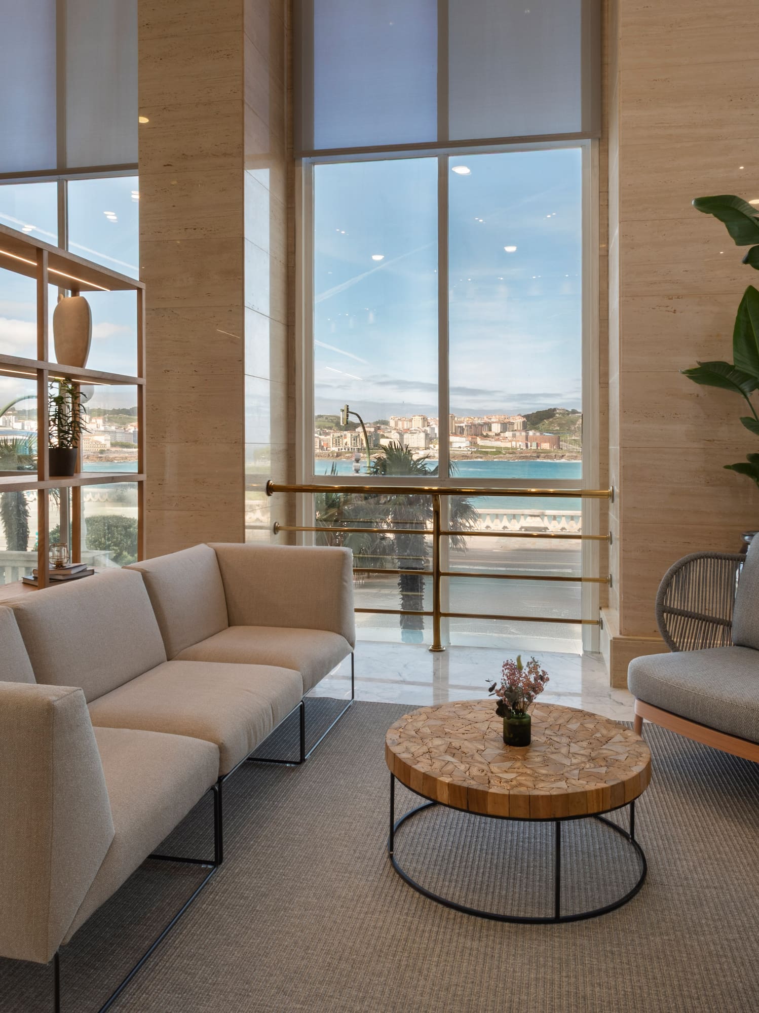 a room with a couch and chairs